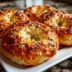 Freshly prepared air fryer protein bagels on white plate