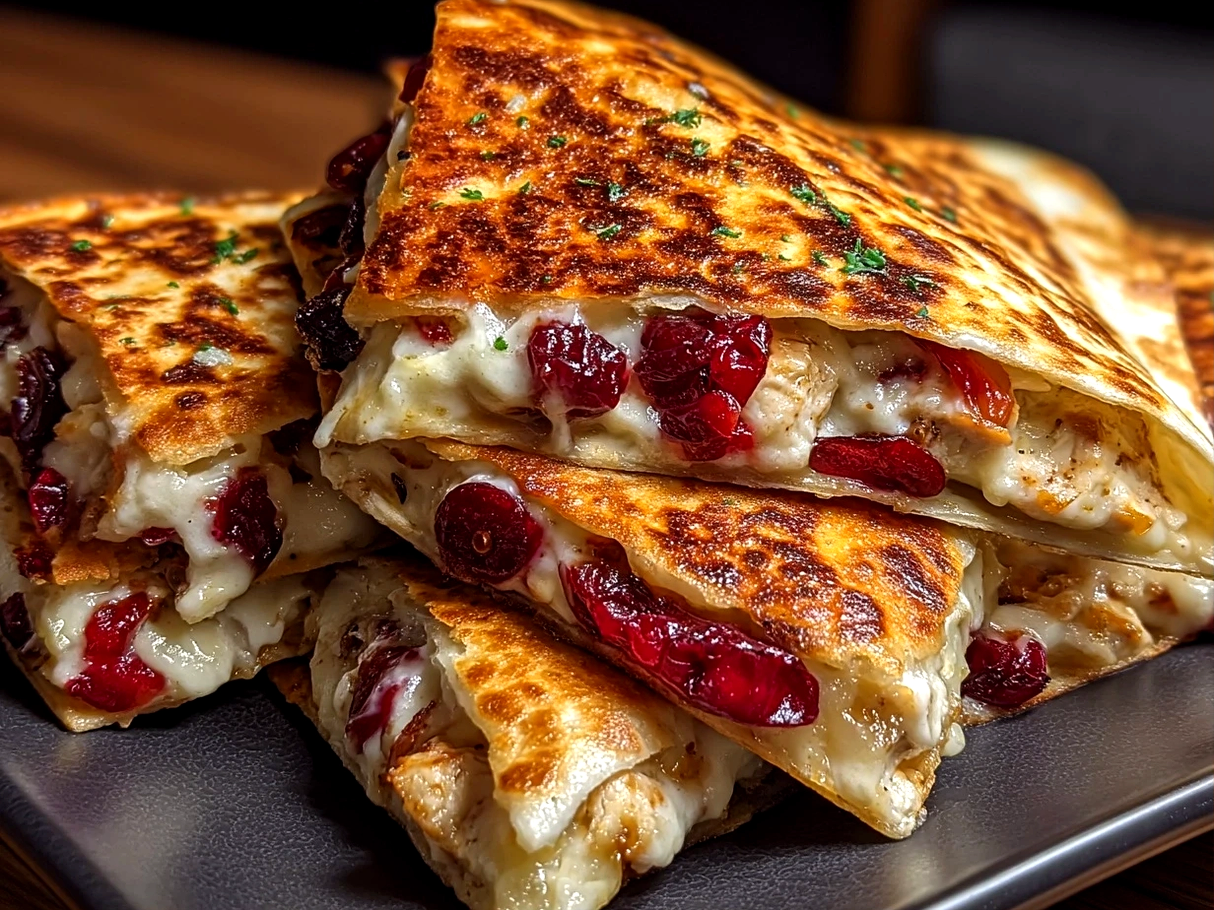 Slight angle close up finished comforting turkey cranberry quesadilla